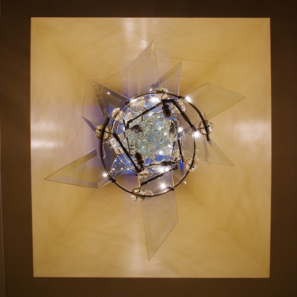 a custom light sculpture resembling a DNA Double Helix strand affixed to the ceiling