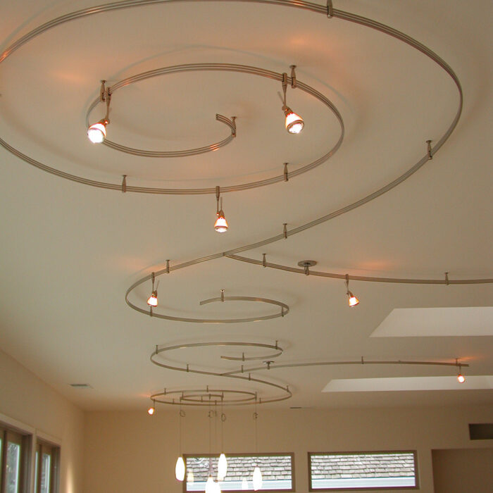 an image of an interior lighting installation of curly lights on a ceiling