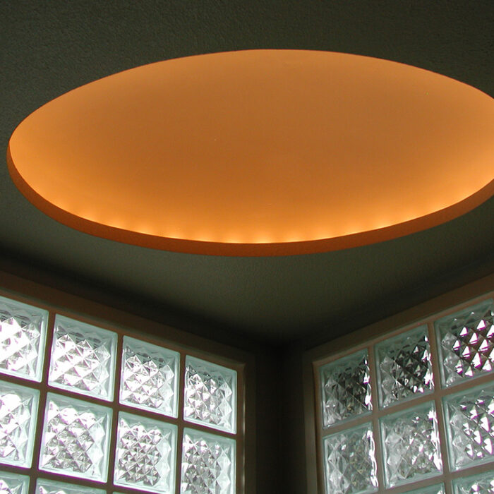 an image of a spa with an illuminated orange disc above it